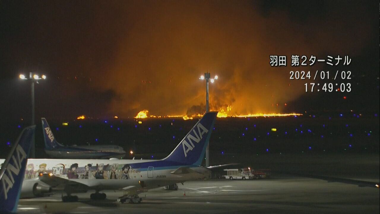 PHOTOS: Passenger plane bursts into flames at Japan airport after